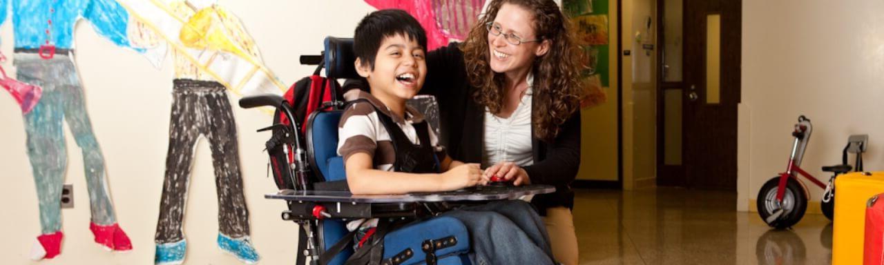 Adult with child in wheelchair
